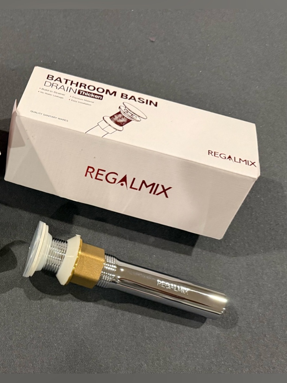 Regalmix bathroom basin drain featuring a pop-up stopper and built-in strainer